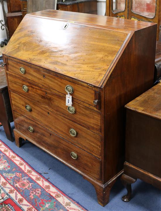 A George III mahogany bureau, fitted fall flap over four graduated long drawers W.99cm